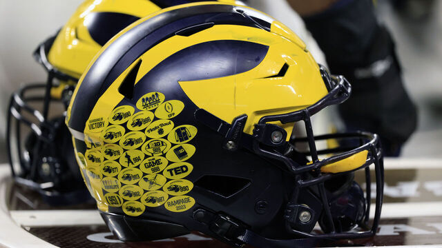 INDIANAPOLIS, INDIANA - DECEMBER 02: A detailed view of the Michigan Wolverine helmet on the sidelines in the game against the Iowa Hawkeyes during the Big Ten Championship at Lucas Oil Stadium on December 02, 2023 in Indianapolis, Indiana.