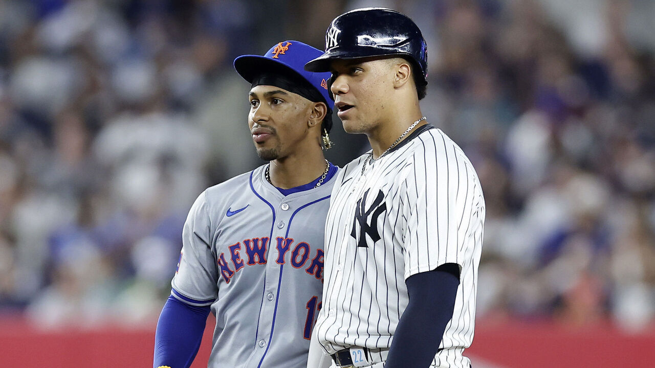 NEW YORK, NEW YORK - JULY 24: Juan Soto #22 of the New York Yankees stands at second base with Francisco Lindor #12 of the New York Mets during the fifth inning of their game at Yankee Stadium on July 24, 2024 in New York City.