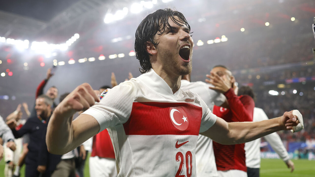 LEIPZIG, GERMANY - JULY 02: Ferdi Kadioglu of Turkey celebrates the 2-1 victory and passage to the quarter finals with team mates and staff following the final whistle of the UEFA EURO 2024 round of 16 match between Austria and Turkiye at Football Stadium Leipzig on July 02, 2024 in Leipzig, Germany.