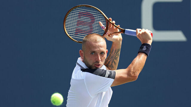 NEW YORK, NEW YORK - AUGUST 27: Daniel Evans of Great Britain returns against Karen Khachanov of Russia rduring their Men's Singles First Round match on Day Two of the 2024 US Open at the USTA Billie Jean King National Tennis Center on August 27, 2024 in the Flushing neighborhood of the Queens borough of New York City.