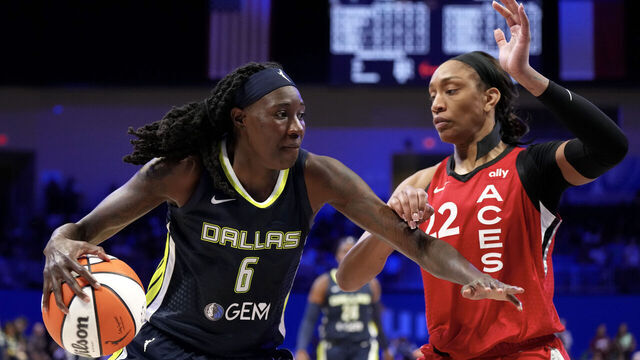 ARLINGTON, TEXAS - AUGUST 27: Natasha Howard #6 of the Dallas Wings is defended by A'ja Wilson #22 of the Las Vegas Aces during the second half at College Park Center on August 27, 2024 in Arlington, Texas.