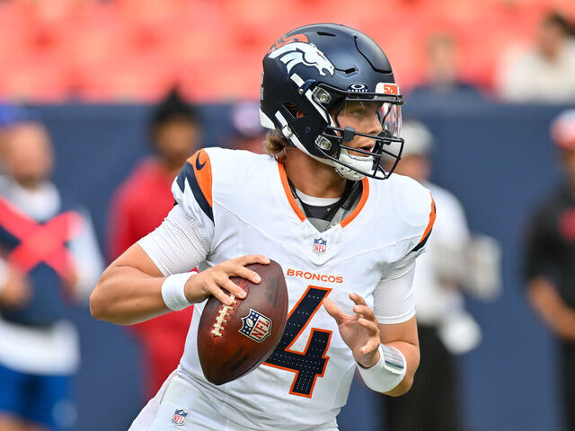DENVER, CO - AUGUST 25: Denver Broncos quarterback Zach Wilson (4) in action during an NFL preseason game between the Denver Broncos and the Arizona Cardinals at Empower Field at Mile High Stadium in Denver, CO on August 25, 2024.