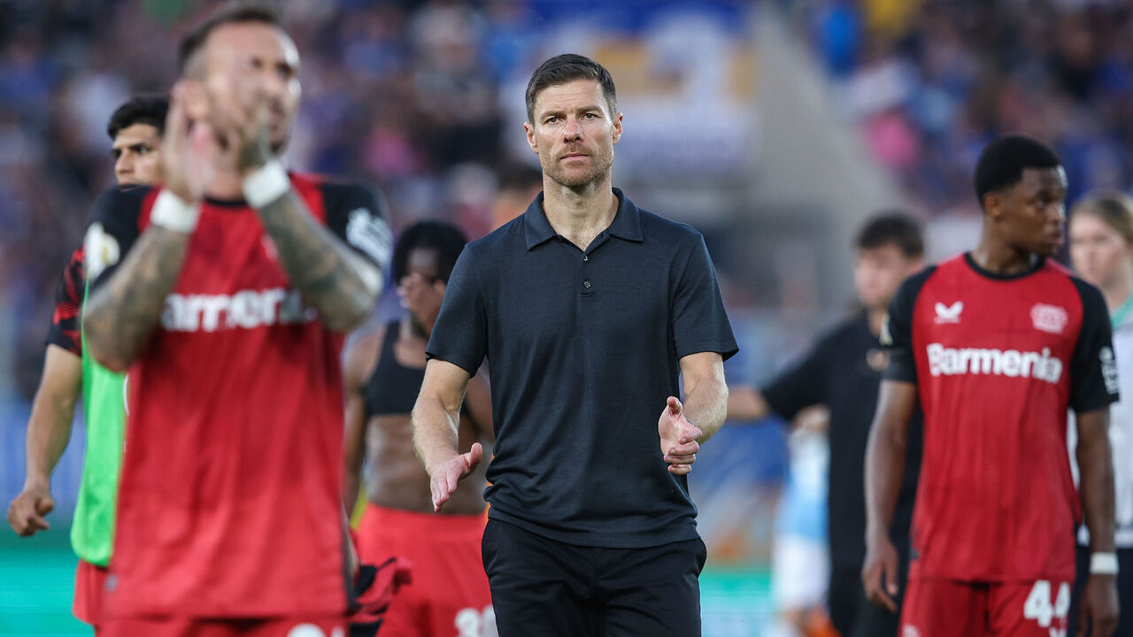 JENA, GERMANY - AUGUST 28: Head coach Xabi Alonso (C) of Bayer 04 Leverkusen reacts at the end of the DFB-Pokal match between FC Carl Zeiss Jena and Bayer 04 Leverkusen at Ernst-Abbe-Sportfeld on August 28, 2024 in Jena, Germany.