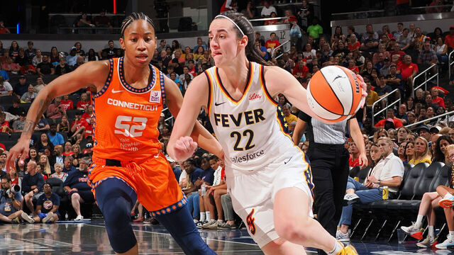 INDIANAPOLIS, IN - AUGUST 28: Caitlin Clark #22 of the Indiana Fever handles the ball during the game against the Connecticut Sun on August 28, 2024 at Gainbridge Fieldhouse in Indianapolis, Indiana. Mandatory Copyright Notice: Copyright 2024 NBAE