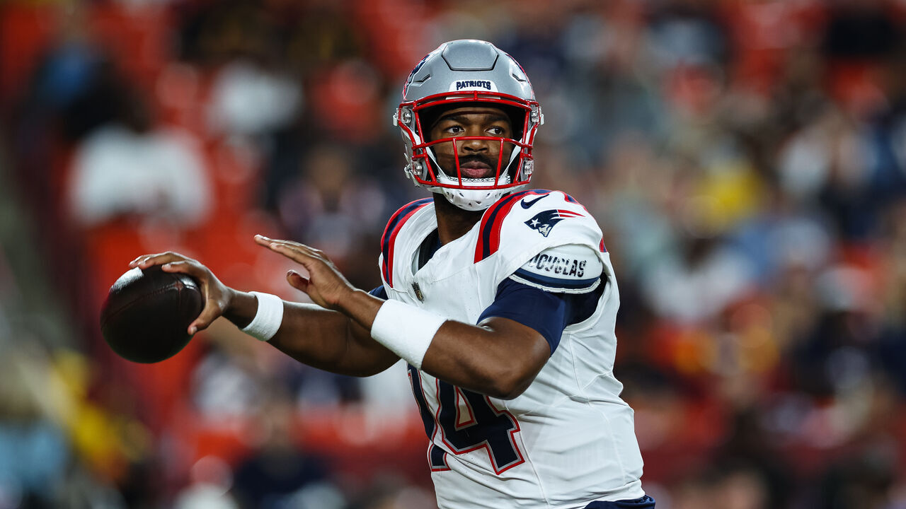 LANDOVER, MD - AUGUST 25: Jacoby Brissett #14 of the New England Patriots looks to pass against the Washington Commanders in the first quarter of a preseason game at Commanders Field on August 25, 2024 in Landover, Maryland.