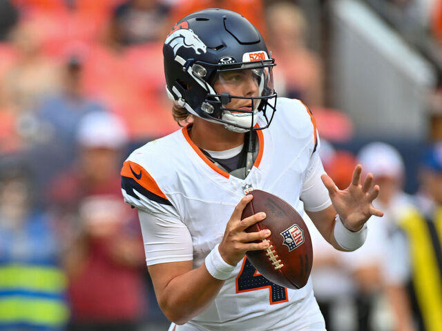DENVER, CO - AUGUST 25: Denver Broncos quarterback Zach Wilson (4) looks for a receiver during an NFL preseason game between the Denver Broncos and the Arizona Cardinals at Empower Field at Mile High Stadium in Denver, CO on August 25, 2024.