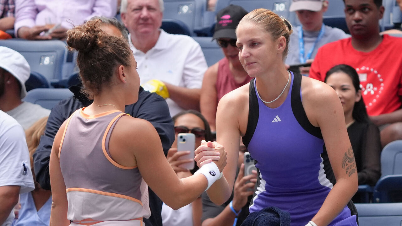 Czech Republic's Karolina Pliskova (R) greets Italy's Jasmine Paolini while retiring from her women's singles second round tennis match with an injured foot on day four of the US Open tennis tournament at the USTA Billie Jean King National Tennis Center in New York City, on August 29, 2024.