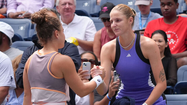 Czech Republic's Karolina Pliskova (R) greets Italy's Jasmine Paolini while retiring from her women's singles second round tennis match with an injured foot on day four of the US Open tennis tournament at the USTA Billie Jean King National Tennis Center in New York City, on August 29, 2024.