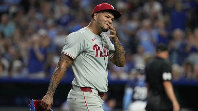 KANSAS CITY, MISSOURI - AUGUST 23: Taijuan Walker #99 of the Philadelphia Phillies walks off the field after throwing in the third inning at Kauffman Stadium on August 23, 2024 in Kansas City, Missouri.