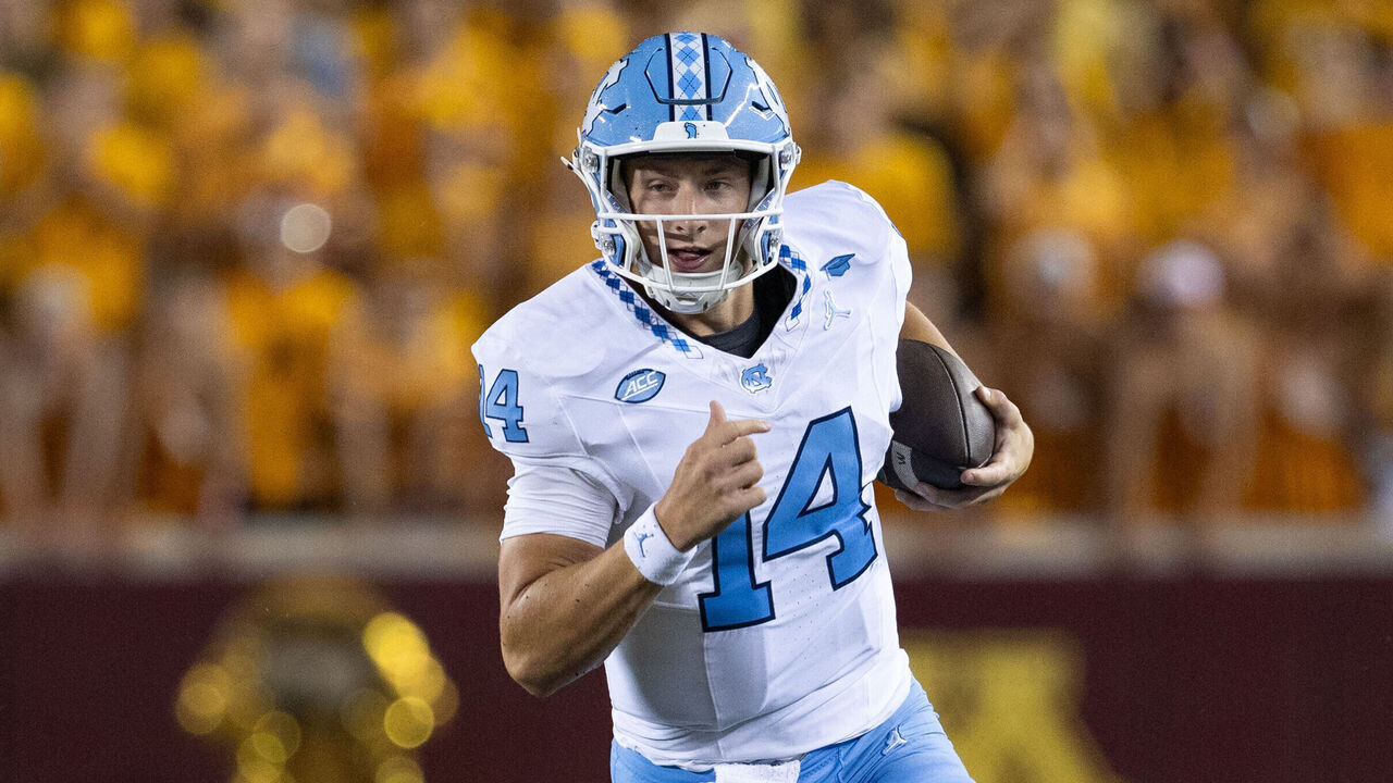 MINNEAPOLIS, MN - AUGUST 29: North Carolina Tar Heels quarterback Max Johnson (14) runs with the ball during the college football game between North Carolina Tar Heels and the Minnesota Golden Gophers on August 29, 2024, at Huntington Bank Stadium in Minneapolis, MN.