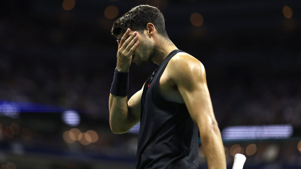 NEW YORK, NEW YORK - AUGUST 29: Carlos Alcaraz of Spain reacts after a point against Botic van De Zandschulp of the Netherlands during their Men's Singles Second Round match on Day Four of the 2024 US Open at USTA Billie Jean King National Tennis Center on August 29, 2024 in the Flushing neighborhood of the Queens borough of New York City.