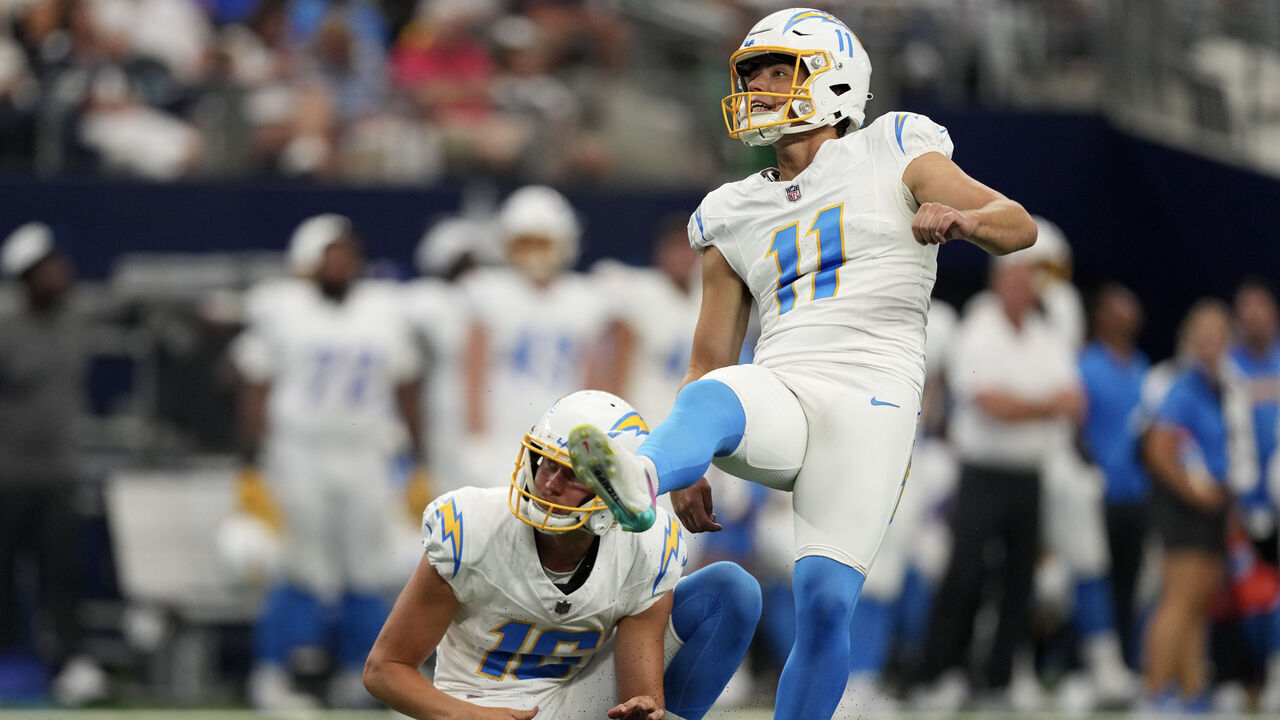 ARLINGTON, TEXAS - AUGUST 24: Cameron Dicker #11 of the Los Angeles Chargers watches the flight of his field goal attempt during the first half of a preseason game \D at AT&T Stadium on August 24, 2024 in Arlington, Texas.