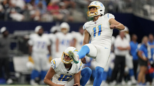 ARLINGTON, TEXAS - AUGUST 24: Cameron Dicker #11 of the Los Angeles Chargers watches the flight of his field goal attempt during the first half of a preseason game \D at AT&T Stadium on August 24, 2024 in Arlington, Texas.