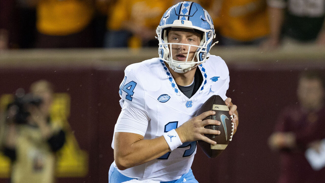MINNEAPOLIS, MN - AUGUST 29: North Carolina Tar Heels quarterback Max Johnson (14) runs with the ball during the college football game between North Carolina Tar Heels and the Minnesota Golden Gophers on August 29, 2024, at Huntington Bank Stadium in Minneapolis, MN.