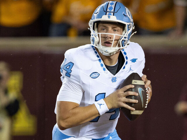 MINNEAPOLIS, MN - AUGUST 29: North Carolina Tar Heels quarterback Max Johnson (14) runs with the ball during the college football game between North Carolina Tar Heels and the Minnesota Golden Gophers on August 29, 2024, at Huntington Bank Stadium in Minneapolis, MN.