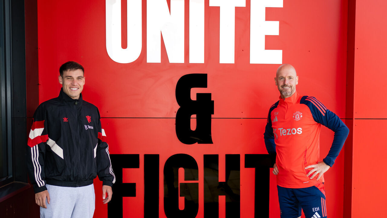 MANCHESTER, ENGLAND - AUGUST 30: (EXCLUSIVE COVERAGE) Manuel Ugarte of Manchester United poses with Manager Erik ten Hag after signing for the club at Carrington Training Ground on August 30, 2024 in Manchester, England.