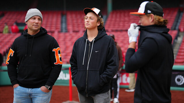 BOSTON, MA - APRIL 10: Jackson Holliday #7 of the Baltimore Orioles talks with father, Matt Holliday, and brother, Ethan Holliday, prior to the game between the Baltimore Orioles and the Boston Red Sox at Fenway Park on Wednesday, April 10, 2024 in Boston, Massachusetts.