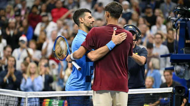 Serbia's Novak Djokovic (L) greets Australia's Alexei Popyrin after his defeat during their men's singles third round match on day five of the US Open tennis tournament at the USTA Billie Jean King National Tennis Center in New York City, on August 30, 2024.