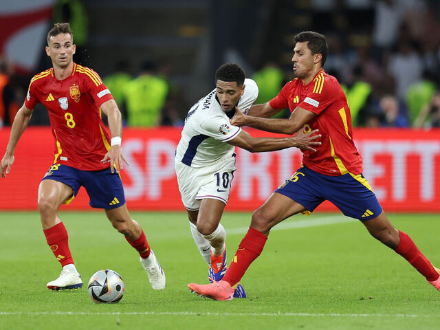 BERLIN, GERMANY - JULY 14: Jude Bellingham of England is challenged by Rodri of Spain during the UEFA EURO 2024 final match between Spain and England at Olympiastadion on July 14, 2024 in Berlin, Germany.