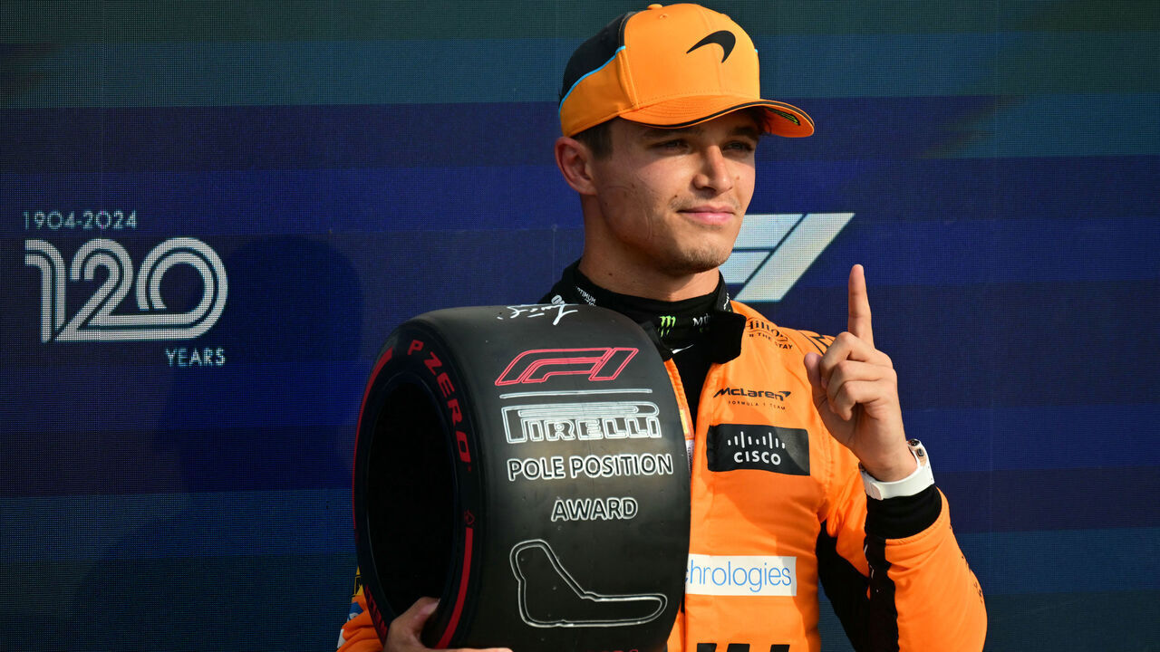 McLaren's British driver Lando Norris celebrates his pole position after the qualifying session, ahead of the Italian Formula One Grand Prix at Autodromo Nazionale Monza circuit, in Monza on August 31, 2024.