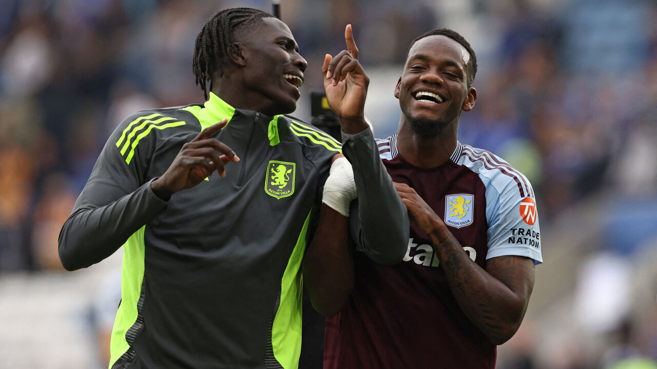 Aston Villa's Belgian defender #24 Amadou Onana (L) and Aston Villa's Columbian striker #09 Jhon Duran (R) celebrate on the pitch after the English Premier League football match between Leicester City and Aston Villa at King Power Stadium in Leicester, central England on August 31, 2024. Villa won the game 2-1.