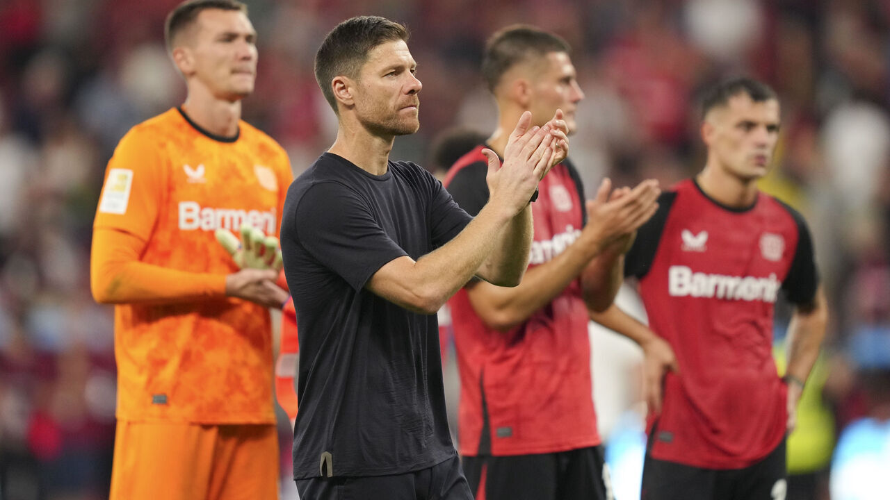 LEVERKUSEN, GERMANY - AUGUST 31: Xabi Alonso, Head Coach of Bayer 04 Leverkusen, acknowledges the supporters following the team's defeated at the end of the Bundesliga match between Bayer 04 Leverkusen and RB Leipzig at BayArena on August 31, 2024 in Leverkusen, Germany.