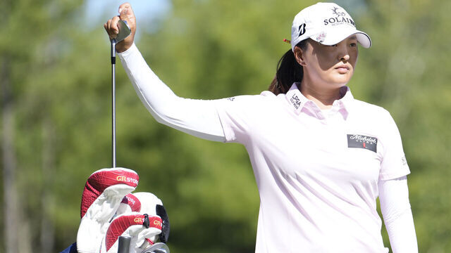 NORTON, MASSACHUSETTS - AUGUST 31: Jin Young Ko of South Korea selects a club during the third round of the FM Championship 2024 at TPC Boston on August 31, 2024 in Norton, Massachusetts.