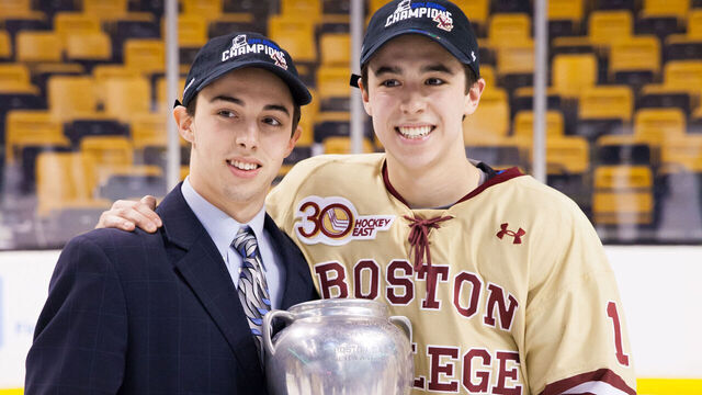 BOSTON, MA - FEBRUARY 10: Brothers Johnny Gaudreau #13 and Matthew Gaudreau #21 of the Boston College Eagles celebrate after the Eagles beat the Northeastern University Huskies to win their fifth Beanpot Championship in a row in NCAA hockey action in the championship game of the annual Beanpot Hockey Tournament at TD Garden on February 10, 2014 in Boston, Massachusetts.