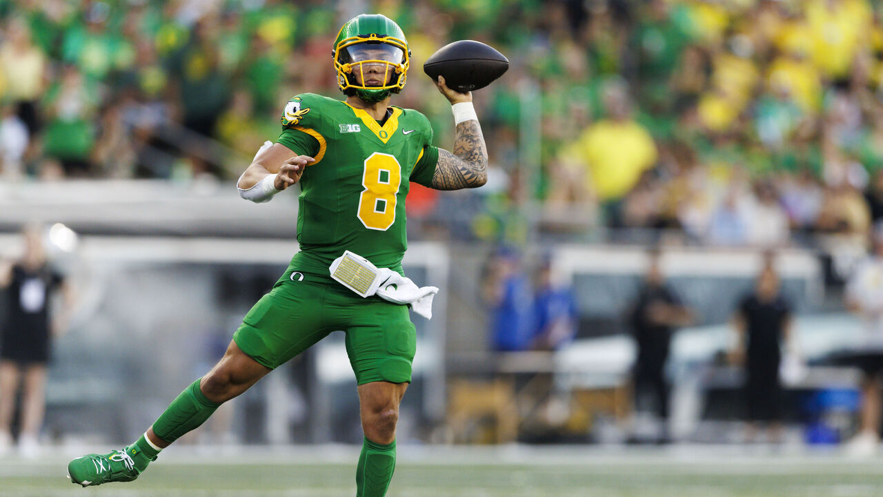 EUGENE, OREGON - AUGUST 31: Dillon Gabriel #8 of the Oregon Ducks throws on the run during a game against Idaho Vandals at Autzen Stadium on August 31, 2024 in Eugene, Oregon.