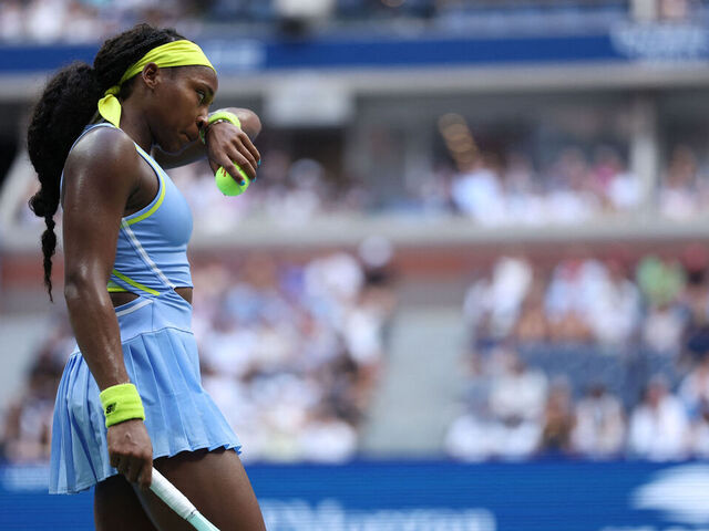 USA's Coco Gauff wipes her face during her women's singles round of 16 tennis match against USA's Emma Navarro on day seven of the US Open tennis tournament at the USTA Billie Jean King National Tennis Center in New York City, on September 1, 2024.