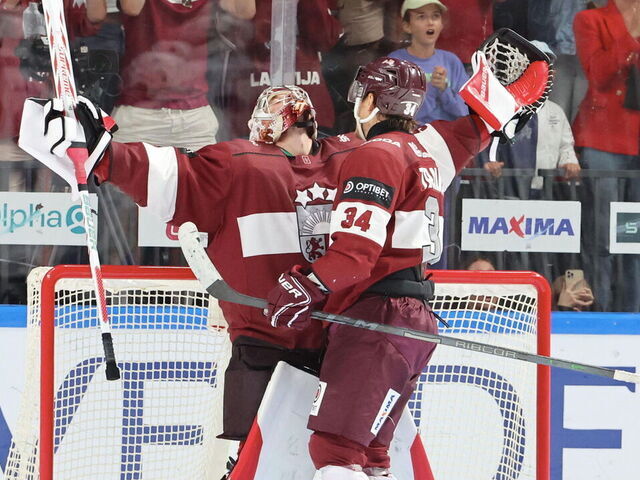 RIGA, LATVIA - SEPTEMBER 01: Kristers Gudlevskis #50 of Latvia celebrate the victory and his qualification with Eduards Tralmaks #34 after the Men's Final Olympic Qualification - Group E match between Latvia and France on September 1st, 2024 in Riga, Latvia.