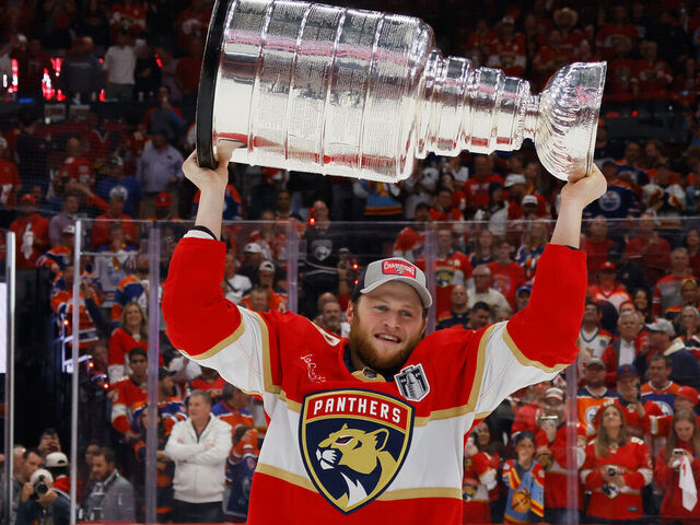 SUNRISE, FLORIDA - JUNE 24: Steven Lorentz #18 of the Florida Panthers celebrates with the Stanley Cup following a 2-1 victory over the Edmonton Oilers in Game Seven of the 2024 NHL Stanley Cup Final at Amerant Bank Arena on June 24, 2024 in Sunrise, Florida.