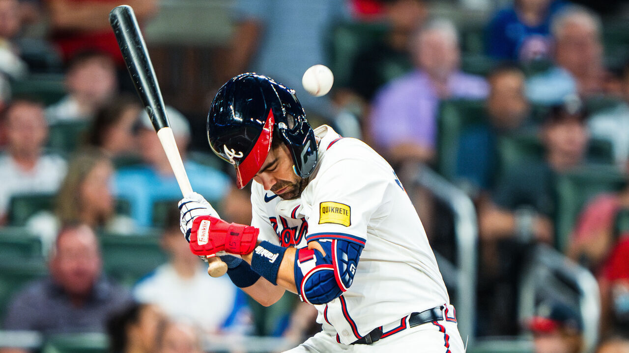 ATLANTA, GA - SEPTEMBER 09: Whit Merrifield #15 of the Atlanta Braves is hit by a pitch during the seventh inning against the Colorado Rockies at Truist Park on September 3, 2024 in Atlanta, Georgia.