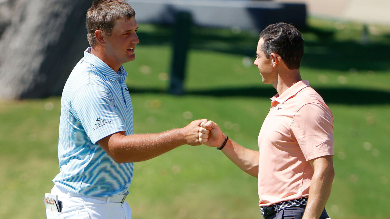 FORT WORTH, TEXAS - JUNE 14: Bryson DeChambeau of the United States and Rory McIlroy of Northern Ireland bump fists after finishing on the 18th green during the final round of the Charles Schwab Challenge on June 14, 2020 at Colonial Country Club in Fort Worth, Texas.
