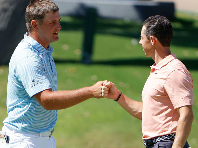 FORT WORTH, TEXAS - JUNE 14: Bryson DeChambeau of the United States and Rory McIlroy of Northern Ireland bump fists after finishing on the 18th green during the final round of the Charles Schwab Challenge on June 14, 2020 at Colonial Country Club in Fort Worth, Texas.