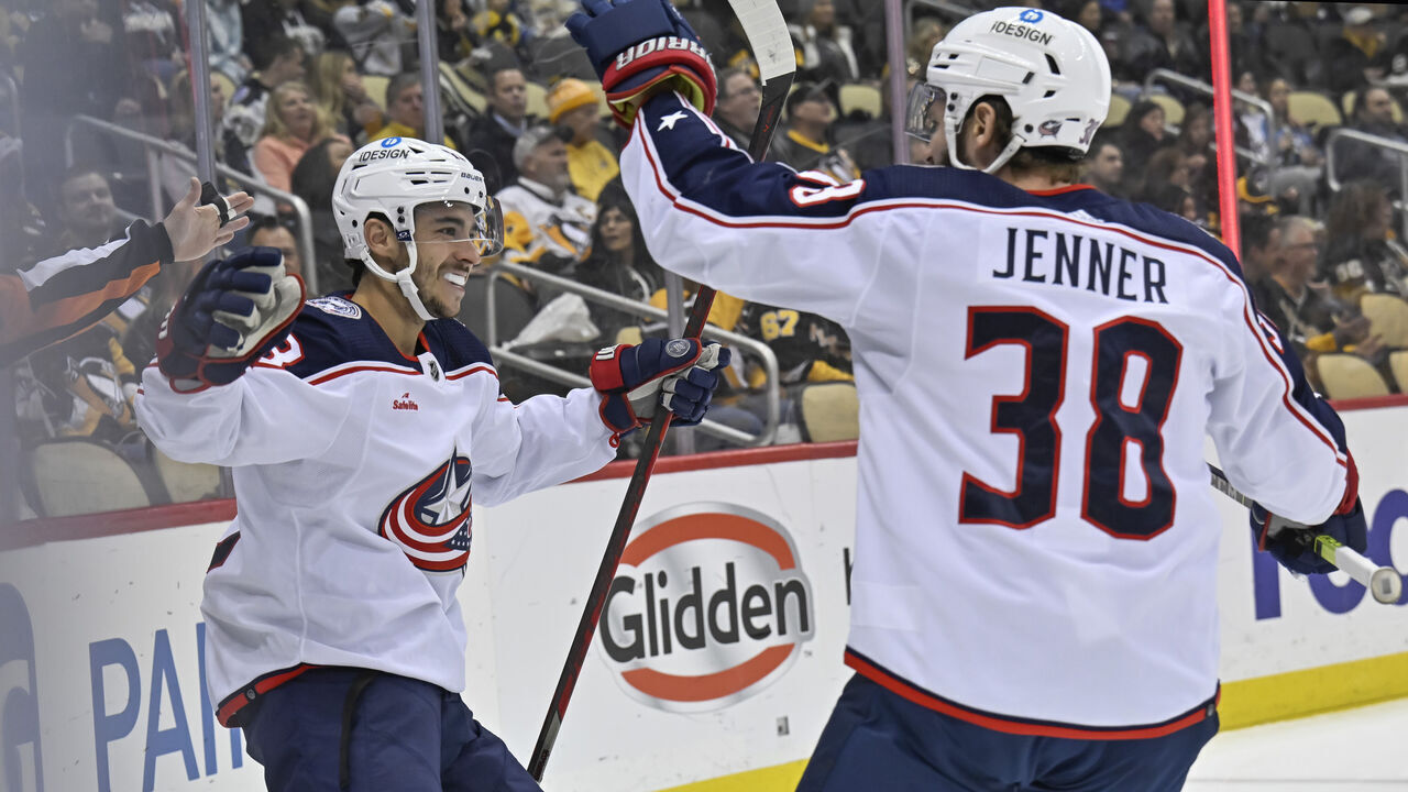 PITTSBURGH, PA - DECEMBER 06: Columbus Blue Jackets Left Wing Johnny Gaudreau (13) celebrates his goal with Columbus Blue Jackets Center Boone Jenner (38) during the first period in the NHL game between the Pittsburgh Penguins and the Columbus Blue Jackets on December 6, 2022, at PPG Paints Arena in Pittsburgh, PA.