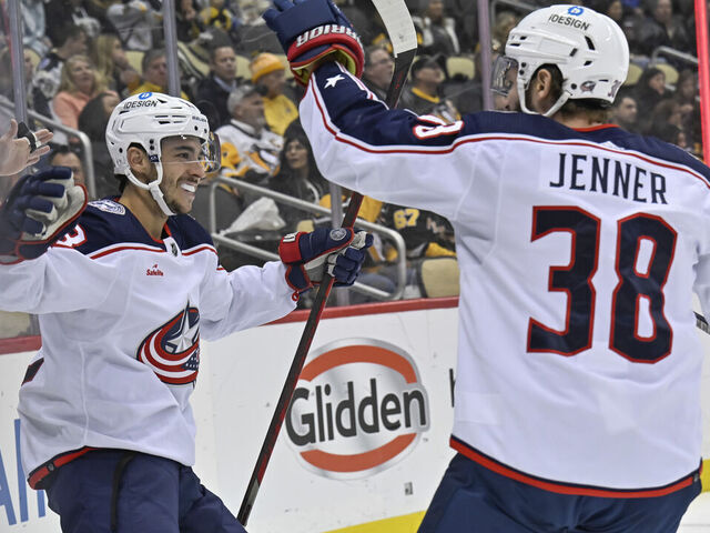 PITTSBURGH, PA - DECEMBER 06: Columbus Blue Jackets Left Wing Johnny Gaudreau (13) celebrates his goal with Columbus Blue Jackets Center Boone Jenner (38) during the first period in the NHL game between the Pittsburgh Penguins and the Columbus Blue Jackets on December 6, 2022, at PPG Paints Arena in Pittsburgh, PA.