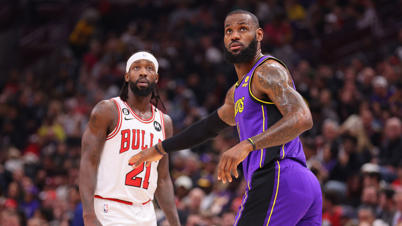 CHICAGO, ILLINOIS - MARCH 29: Patrick Beverley #21 of the Chicago Bulls and LeBron James #6 of the Los Angeles Lakers look on during the first half at United Center on March 29, 2023 in Chicago, Illinois.
