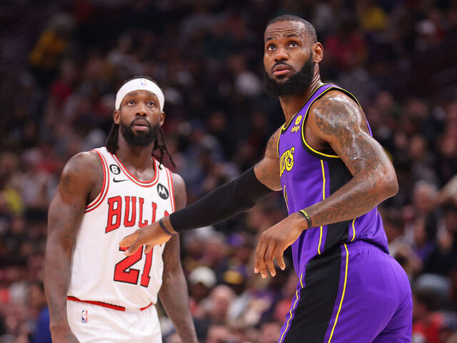 CHICAGO, ILLINOIS - MARCH 29: Patrick Beverley #21 of the Chicago Bulls and LeBron James #6 of the Los Angeles Lakers look on during the first half at United Center on March 29, 2023 in Chicago, Illinois.