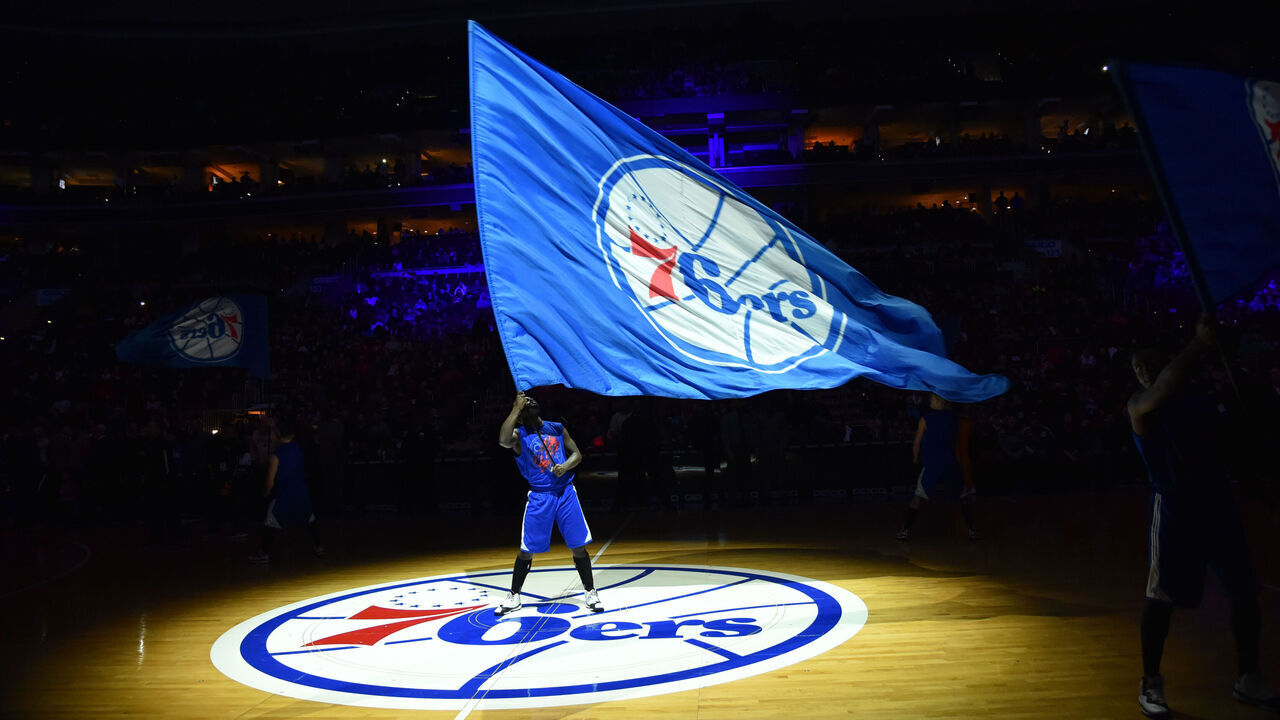 PHILADELPHIA, PA - JANUARY 10: A member of the Philadelphia 76ers dance team holds the team flag logo against the Indiana Pacers at Wells Fargo Center on January 10, 2015 in Philadelphia, Pennsylvania NOTE TO USER: User expressly acknowledges and agrees that, by downloading and/or using this Photograph, user is consenting to the terms and conditions of the Getty Images License Agreement. Mandatory Copyright Notice: Copyright 2015 NBAE