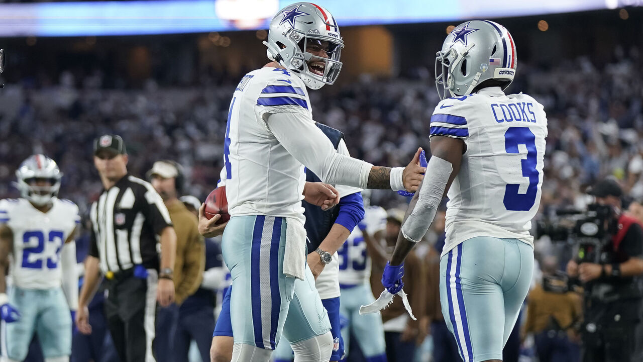 ARLINGTON, TEXAS - NOVEMBER 12: Dak Prescott #4 of the Dallas Cowboys and Brandin Cooks #3 celebrate after connecting for a touchdown during the first half against the New York Giants at AT&T Stadium on November 12, 2023 in Arlington, Texas.