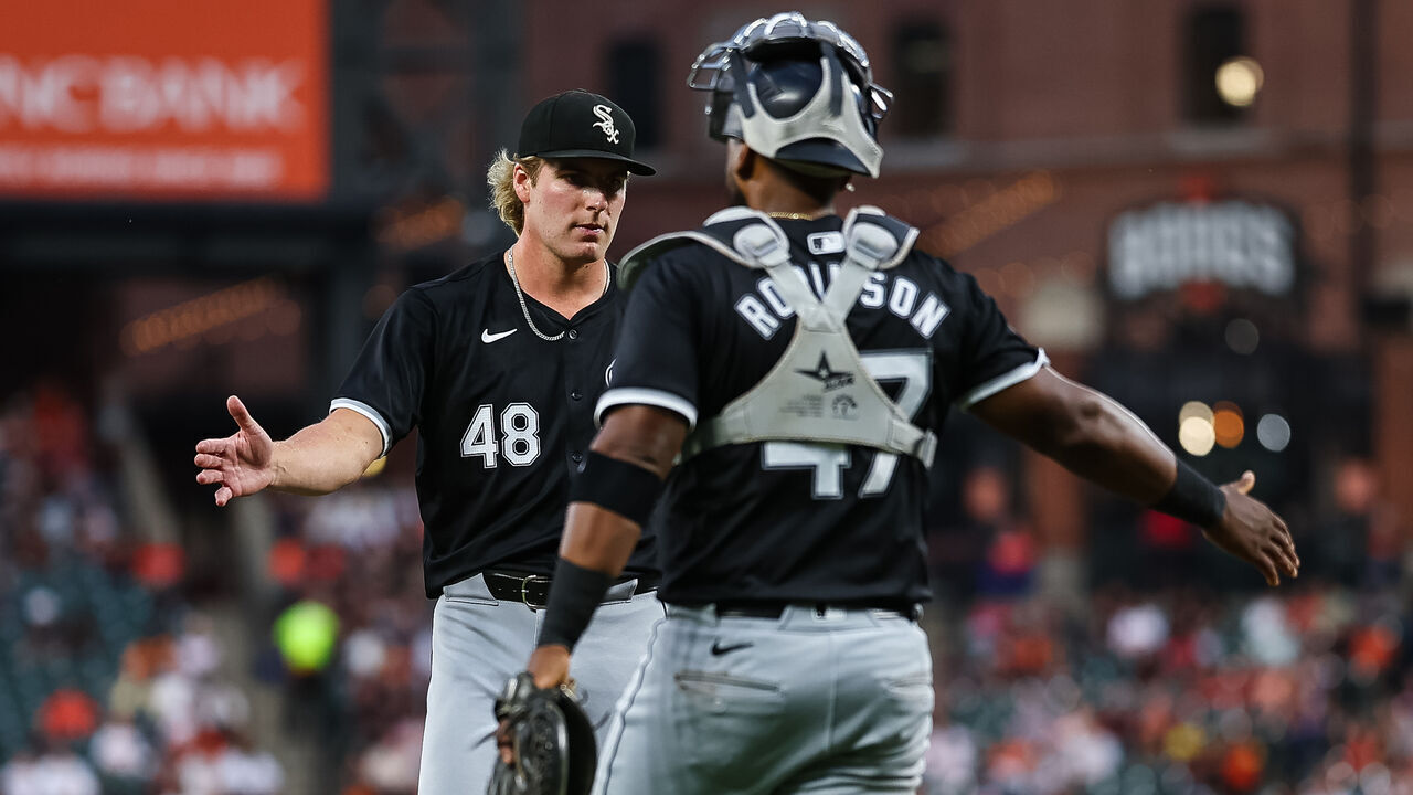 BALTIMORE, MD - SEPTEMBER 04: Jonathan Cannon #48 and Chuckie Robinson #47 of the Chicago White Sox celebrate after the final out of the third inning against the Baltimore Orioles at Oriole Park at Camden Yards on September 4, 2024 in Baltimore, Maryland.