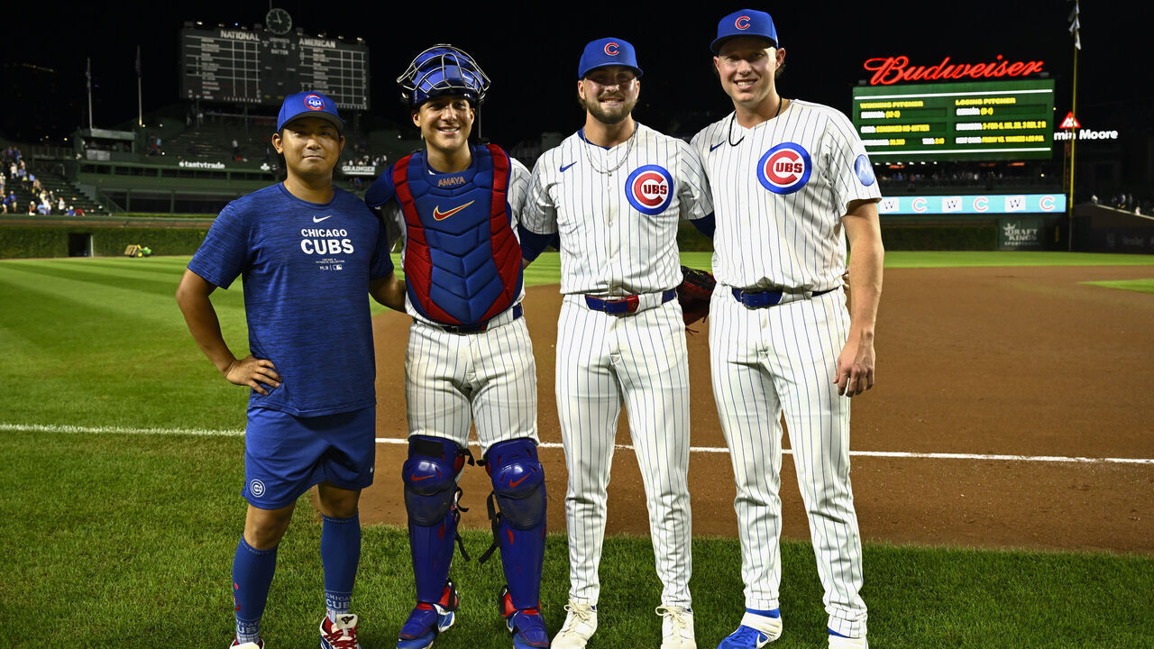 CHICAGO, ILLINOIS - SEPTEMBER 04: Shota Imanaga #18, Miguel Amaya #9, Porter Hodge #37, and Nate Pearson #56 of the Chicago Cubs pose for a photo after the 12-0 win against the Pittsburgh Pirates at Wrigley Field on September 04, 2024 in Chicago, Illinois.