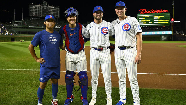 CHICAGO, ILLINOIS - SEPTEMBER 04: Shota Imanaga #18, Miguel Amaya #9, Porter Hodge #37, and Nate Pearson #56 of the Chicago Cubs pose for a photo after the 12-0 win against the Pittsburgh Pirates at Wrigley Field on September 04, 2024 in Chicago, Illinois.
