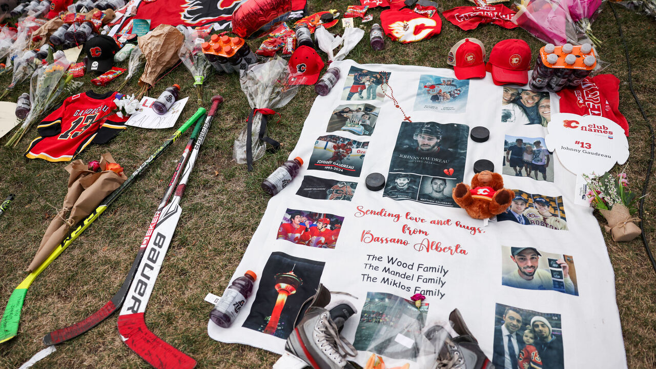 CALGARY, CANADA - SEPTEMBER 04: A growing memorial during the candlelight vigil to former Calgary Flames star Johnny Gaudreau and his brother Matthew at the Scotiabank Saddledome on September 4, 2024, in Calgary, Alberta, Canada. The brothers were killed on August 29 by a suspected drunk driver while they were cycling in Salem County, New Jersey.