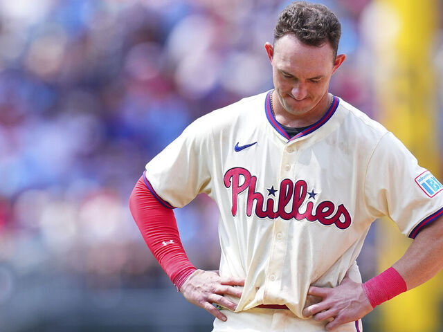 PHILADELPHIA, PENNSYLVANIA - JULY 31: Austin Hays #9 of the Philadelphia Phillies looks on after flying out to end the seventh inning against the New York Yankees at Citizens Bank Park on July 31, 2024 in Philadelphia, Pennsylvania. The Yankees defeated the Phillies 6-5.