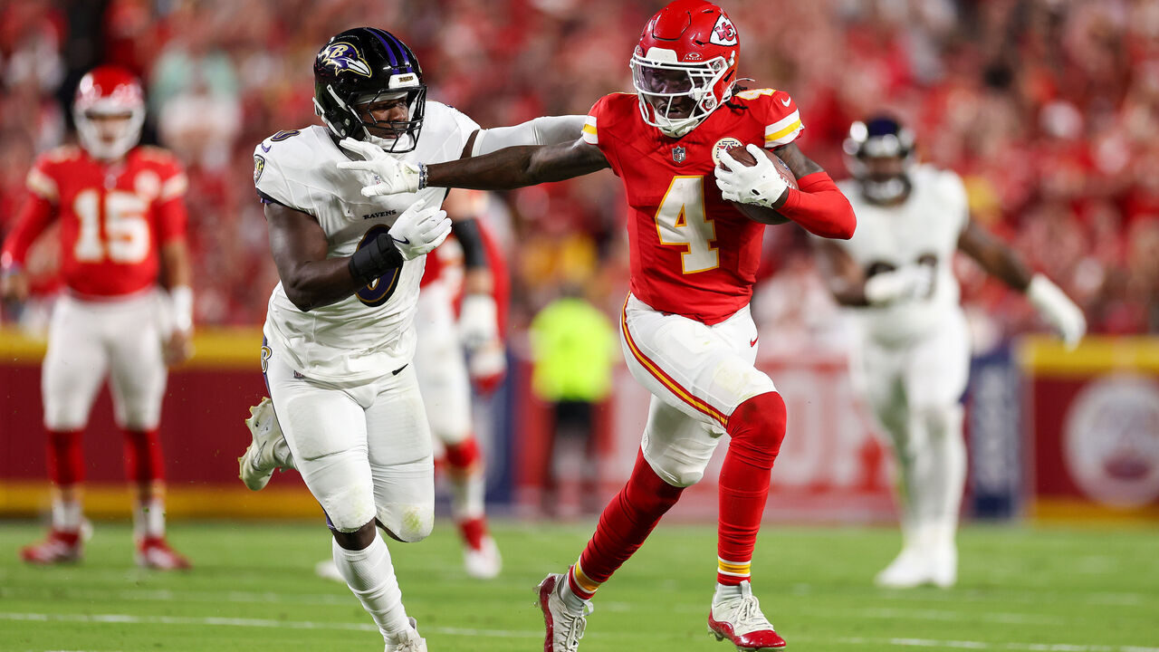 KANSAS CITY, MISSOURI - SEPTEMBER 05: Rashee Rice #4 of the Kansas City Chiefs runs the ball against Roquan Smith #0 of the Baltimore Ravens during the first quarter at GEHA Field at Arrowhead Stadium on September 05, 2024 in Kansas City, Missouri.