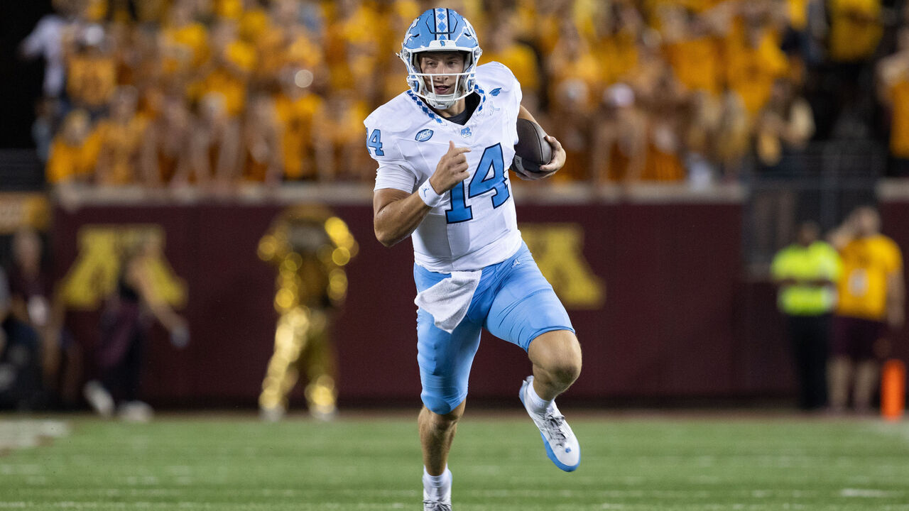 MINNEAPOLIS, MN - AUGUST 29: North Carolina Tar Heels quarterback Max Johnson (14) runs with the ball during the college football game between North Carolina Tar Heels and the Minnesota Golden Gophers on August 29, 2024, at Huntington Bank Stadium in Minneapolis, MN.