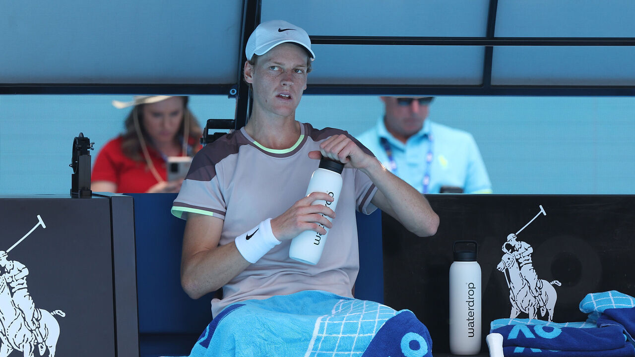 MELBOURNE, AUSTRALIA - JANUARY 26: Jannik Sinner of Italy has a drink in their Semifinal singles match against Novak Djokovic of Serbia during the 2024 Australian Open at Melbourne Park on January 26, 2024 in Melbourne, Australia.