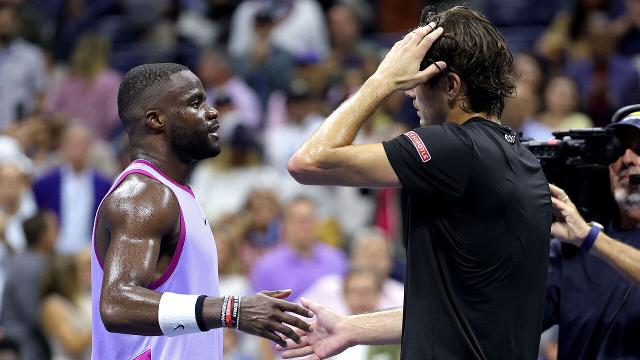 NEW YORK, NEW YORK - SEPTEMBER 06: Taylor Fritz (R) of the United States embraces Frances Tiafoe of the United States after defeating him in their Men's Singles Semifinal match on Day Twelve of the 2024 US Open at USTA Billie Jean King National Tennis Center on September 06, 2024 in the Flushing neighborhood of the Queens borough of New York City.